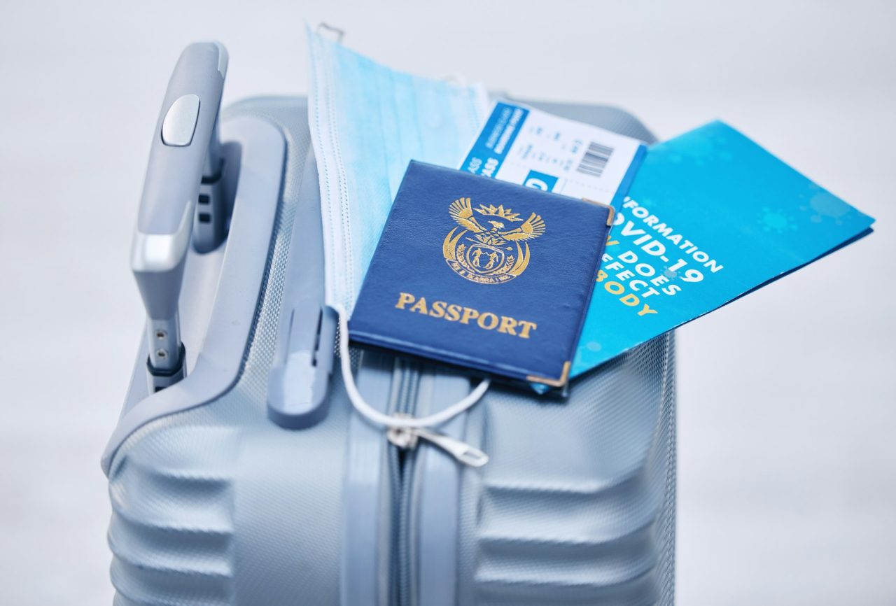 covid-passport-and-suitcase-for-travel-compliance-policy-and-documents-in-global-airport-or-visa.jpg