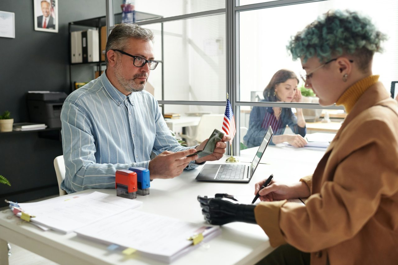 woman-giving-documents-for-visa.jpg
